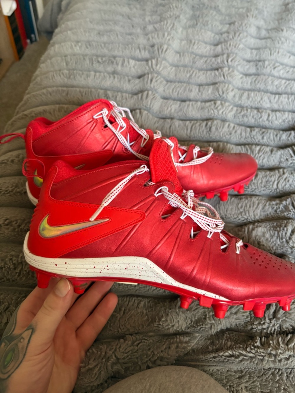 Nike Red Cleats with White Accents and Iridescent Swoosh